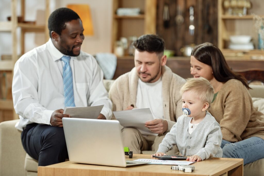 couple-with-kid-having-meeting-with-adviser-2023-11-27-05-14-54-utc-large